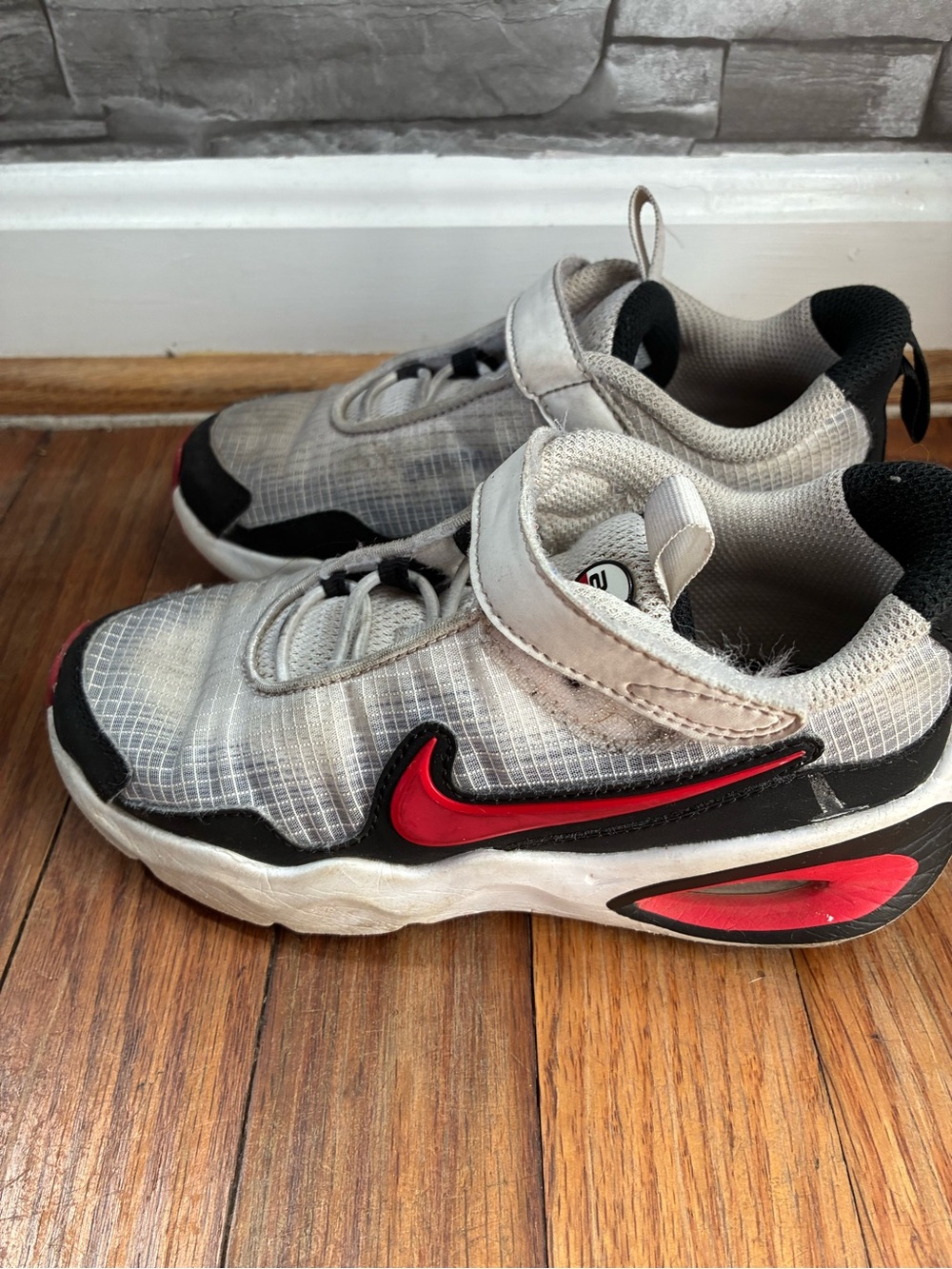 Nike Kids Gray Sneakers with Red Swoosh